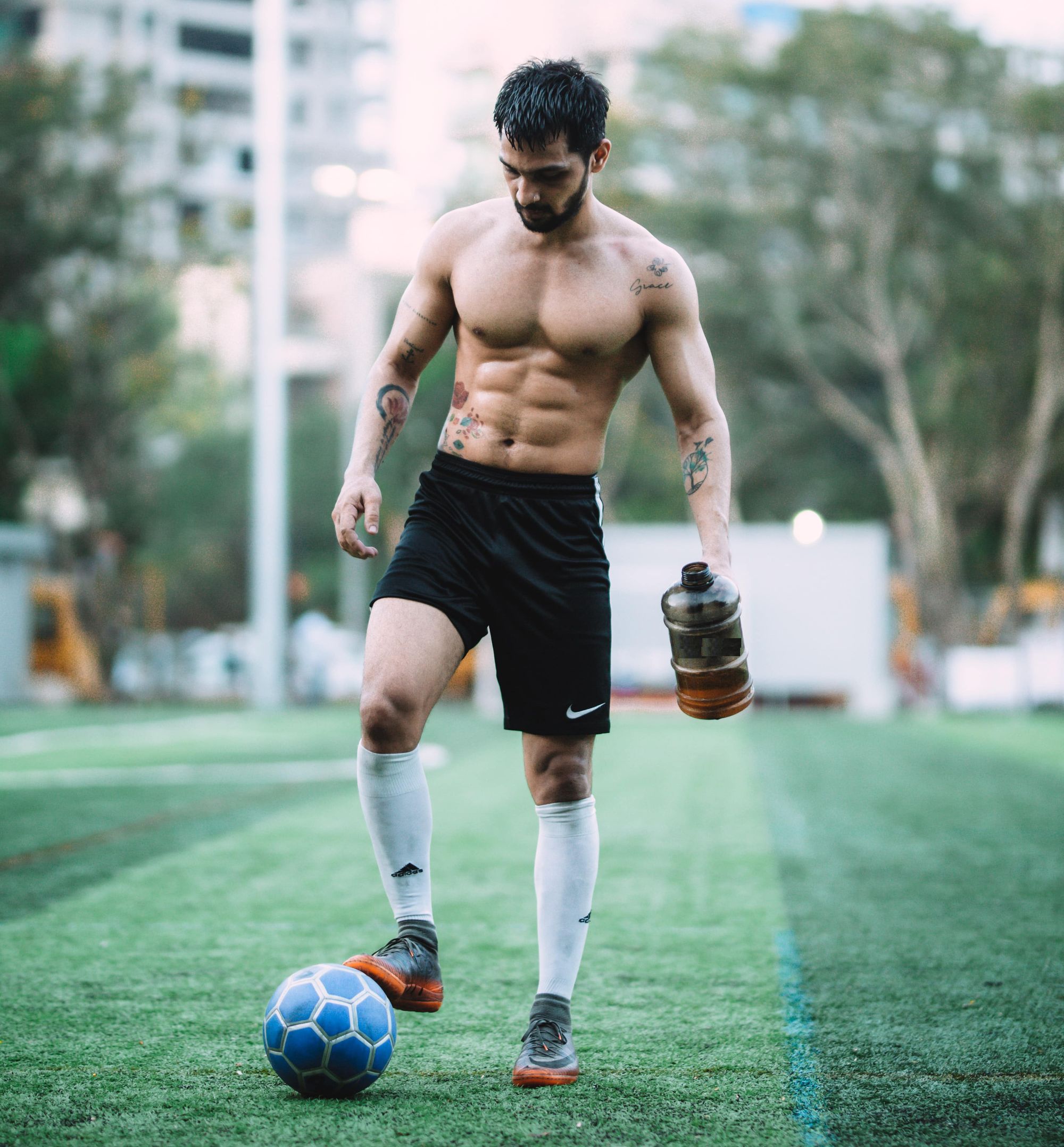 Soccer player taking a break for a protein drink.