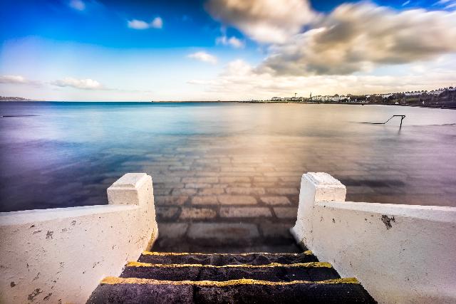 Stairs leading down into water.