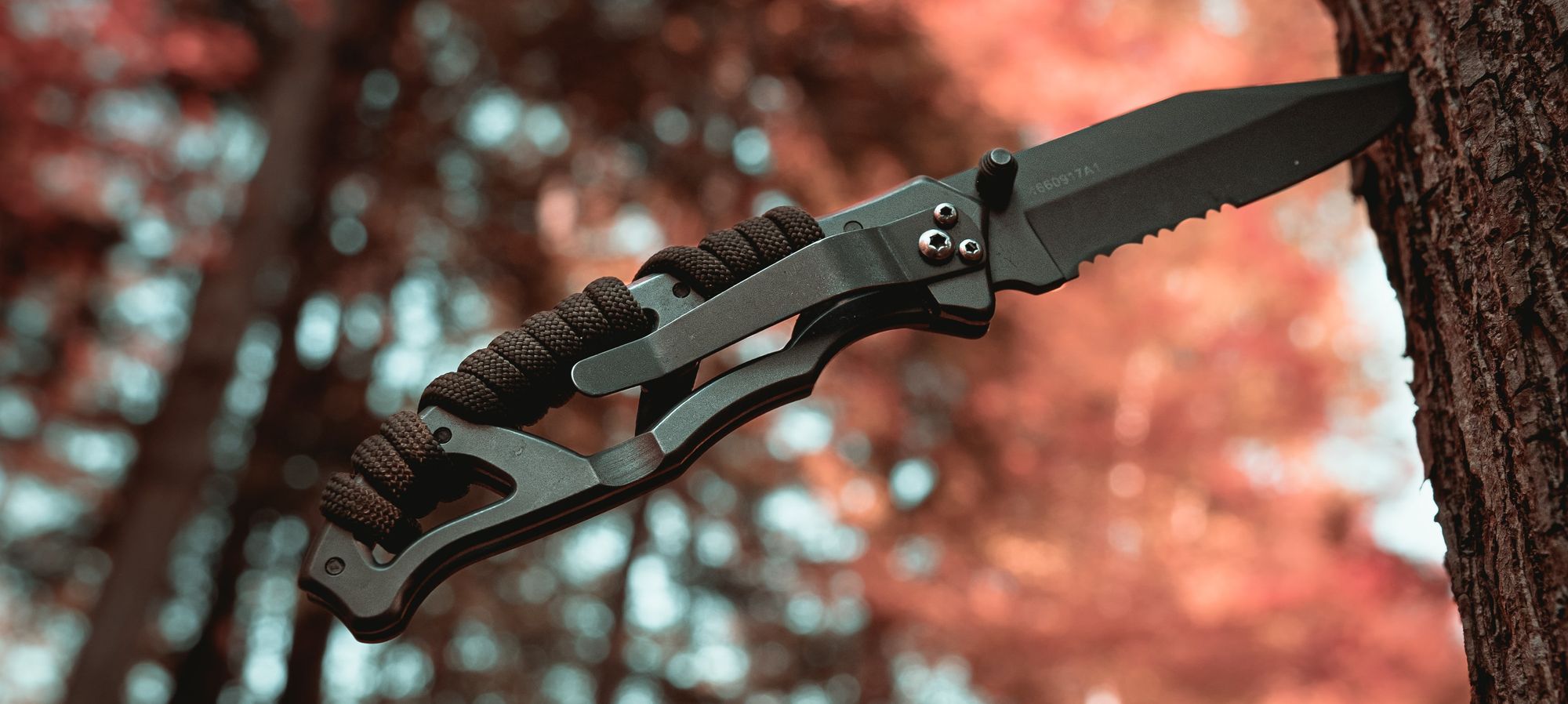 Knife with paracord wrapped handle.