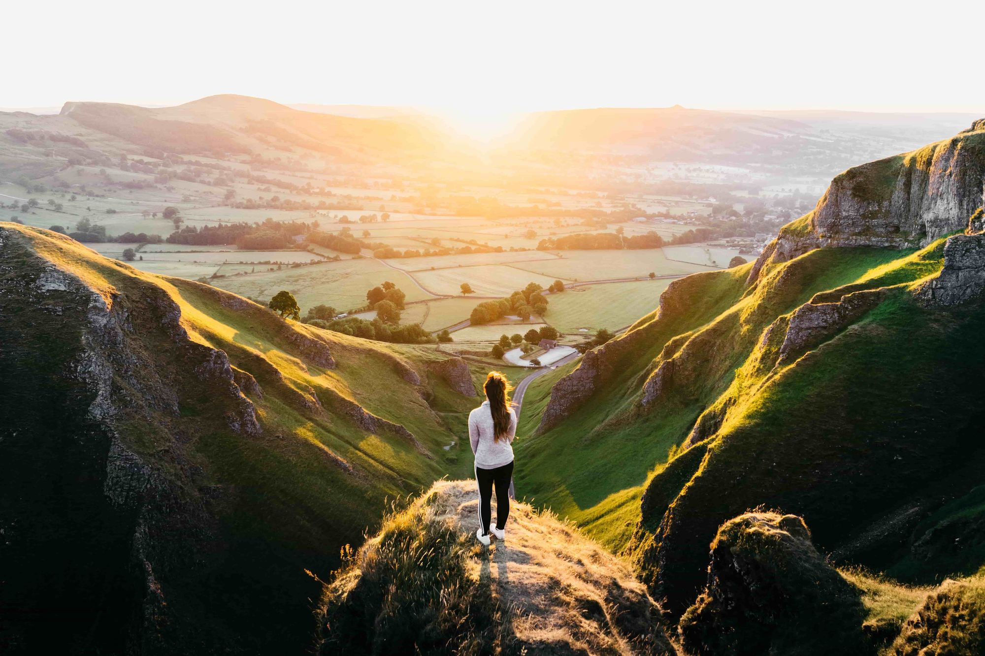 Man walking toward the sun and back to God.