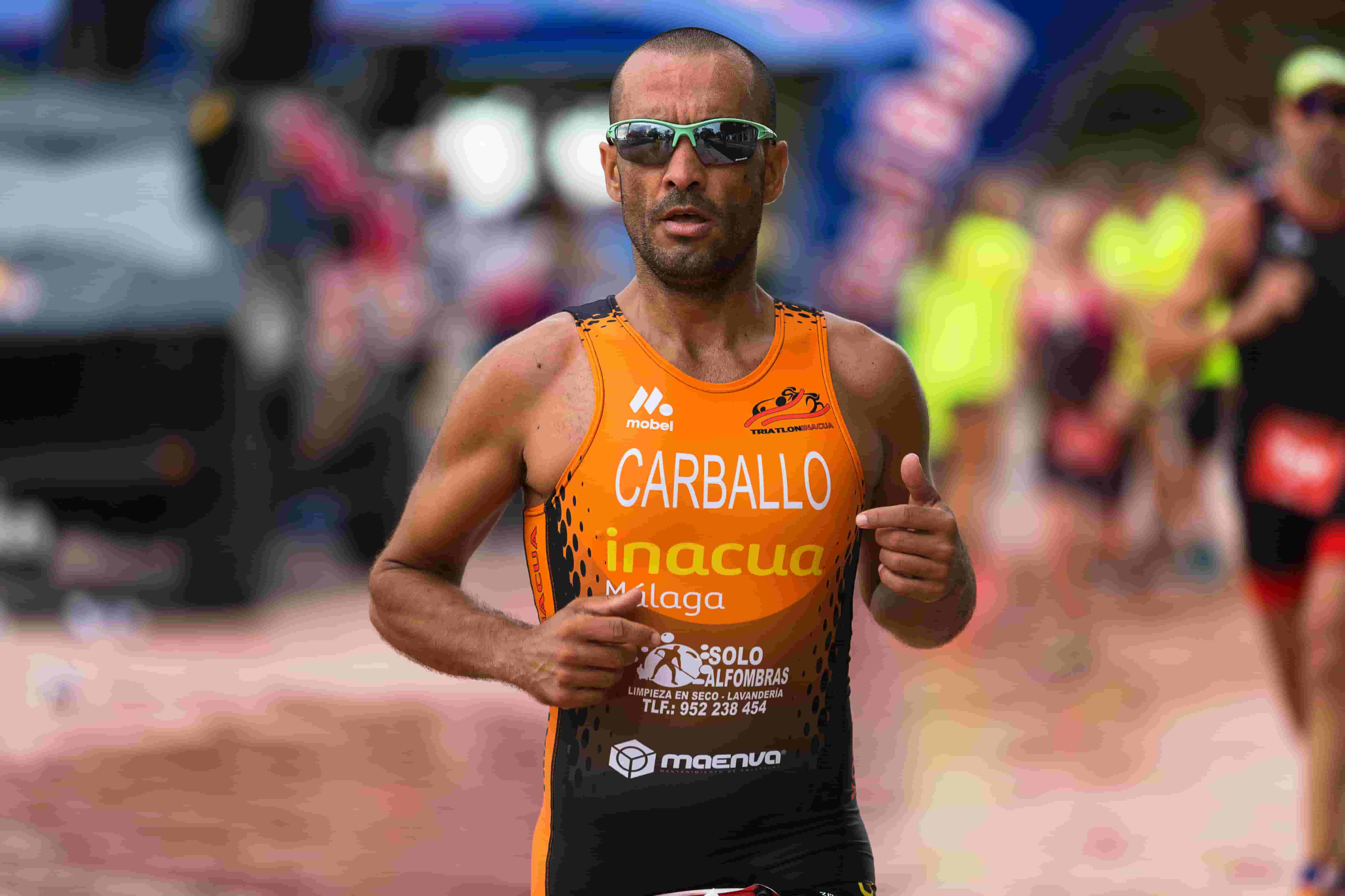 A traithlon runner with sports sunglasses.