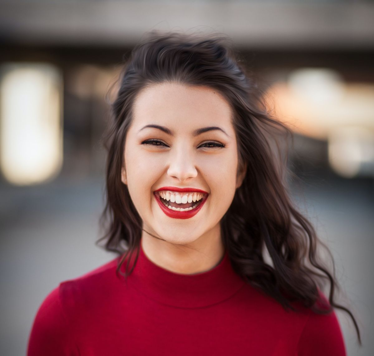Pretty woman in red, smiling.
